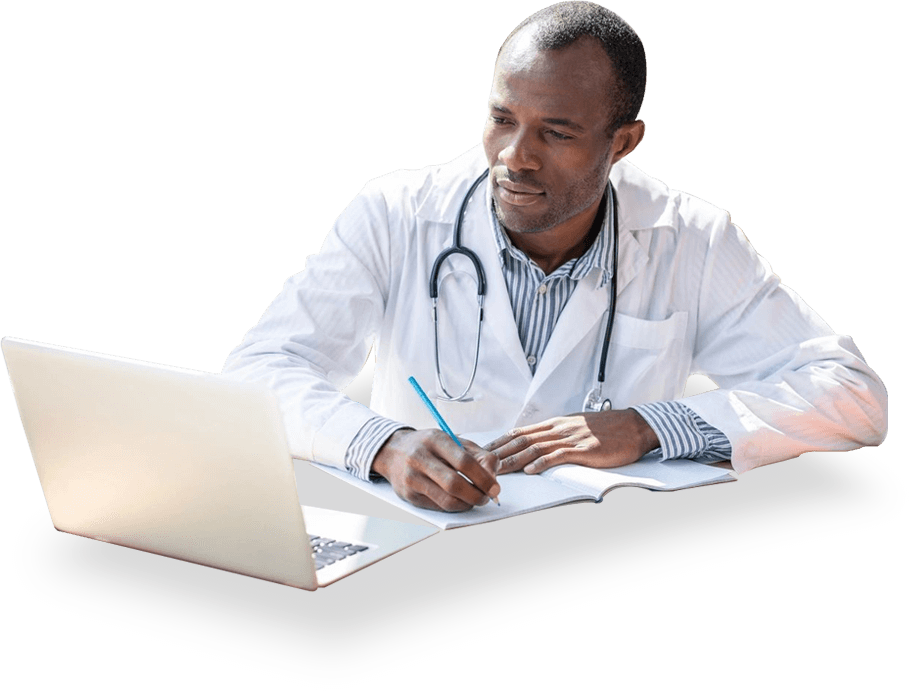 Doctor Using Laptop and Writing